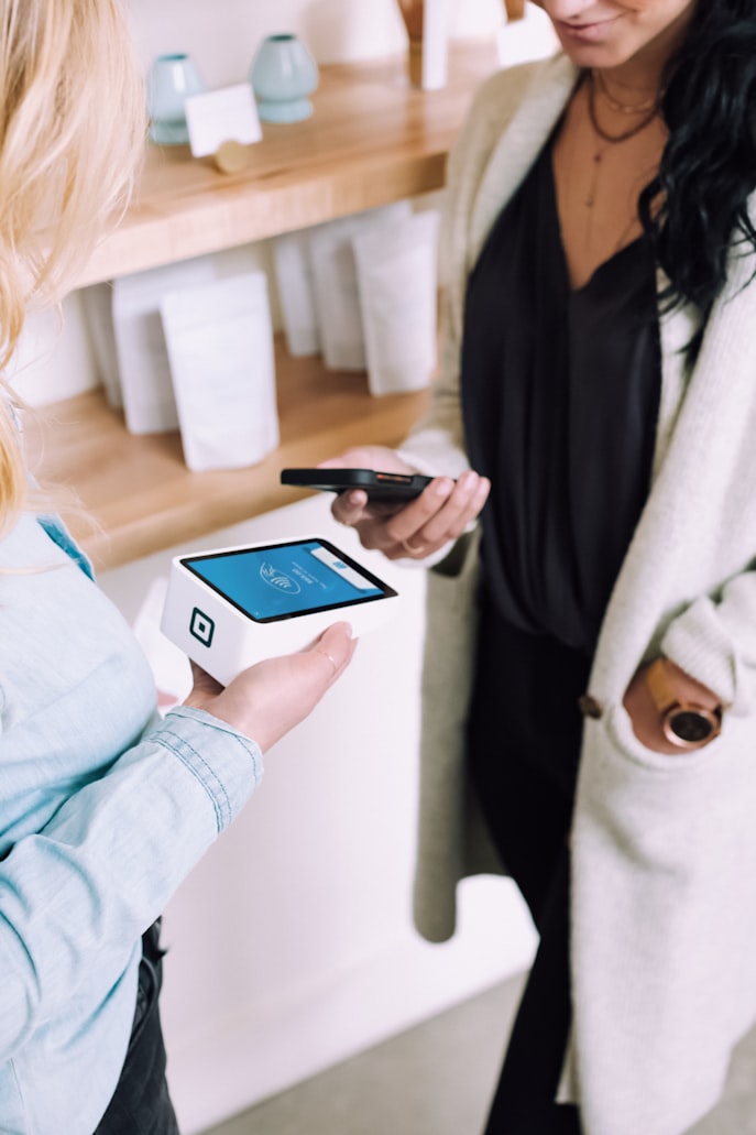 Customer paying with a card on a Square Terminal